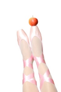 Red apple on pink ballet pointe